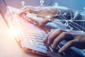 Close up of male hands working on computer keyboard